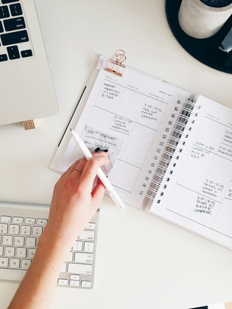 A planner notepad and pen used for homework planning