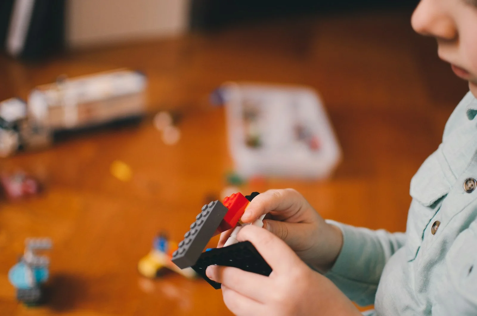 Toddlers focused on building with blocks together, an activity that helps develop executive function skills